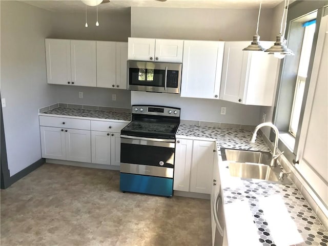 115 Ross St, Confluence Boro, PA 15424 - kitchen with stainless steel appliances, a sink, white cabinets, and light countertops
