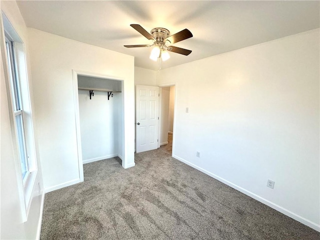 unfurnished bedroom featuring carpet flooring, a closet, and ceiling fan