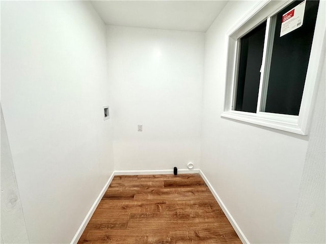 laundry area featuring washer hookup and wood-type flooring