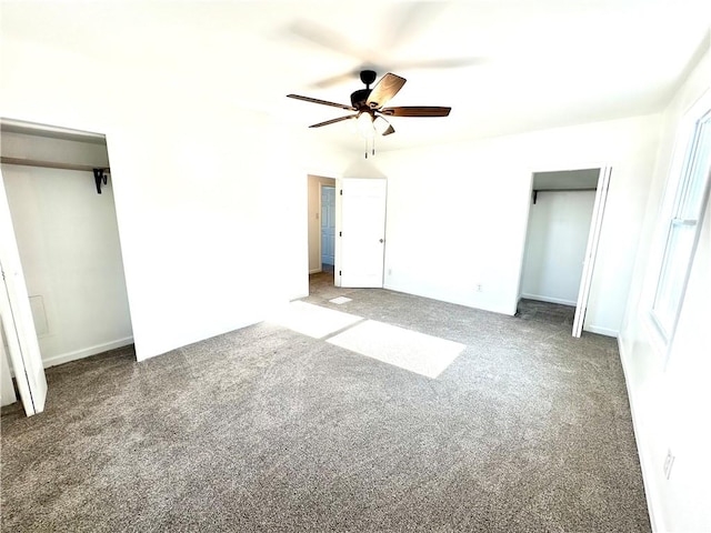 unfurnished bedroom with ceiling fan and dark colored carpet