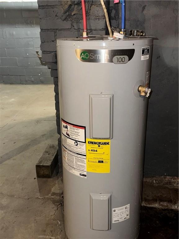 utility room featuring water heater