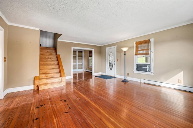 entrance foyer featuring hardwood / wood-style floors, crown molding, and a textured ceiling