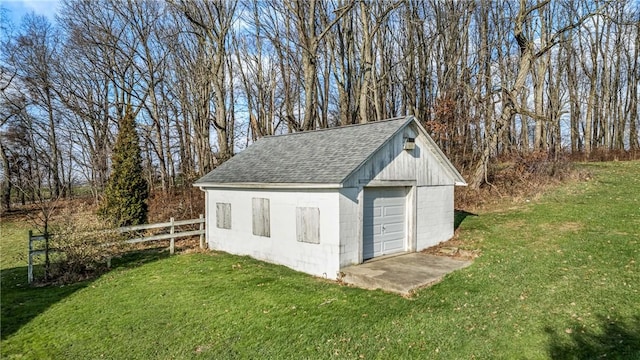 view of outbuilding featuring a yard and a garage