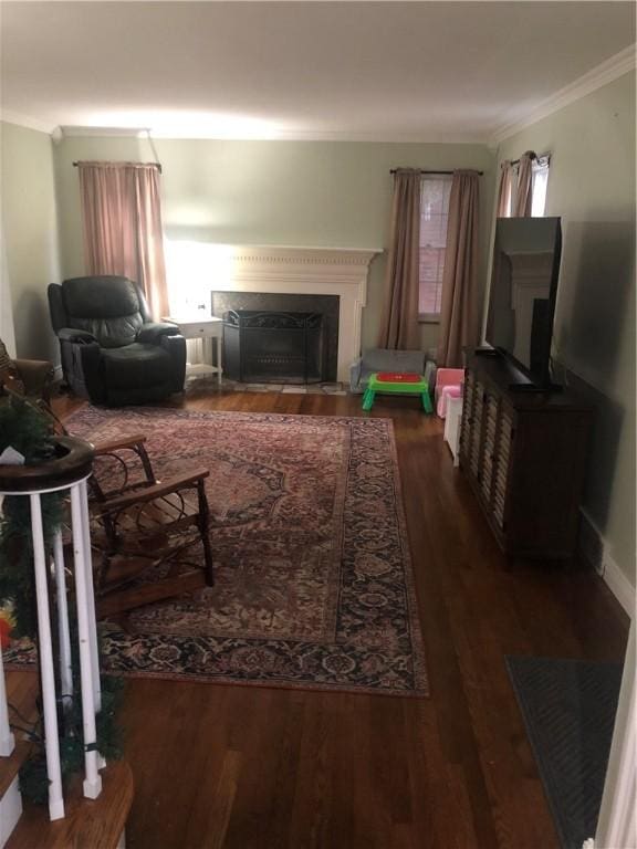 living room with dark hardwood / wood-style floors and ornamental molding