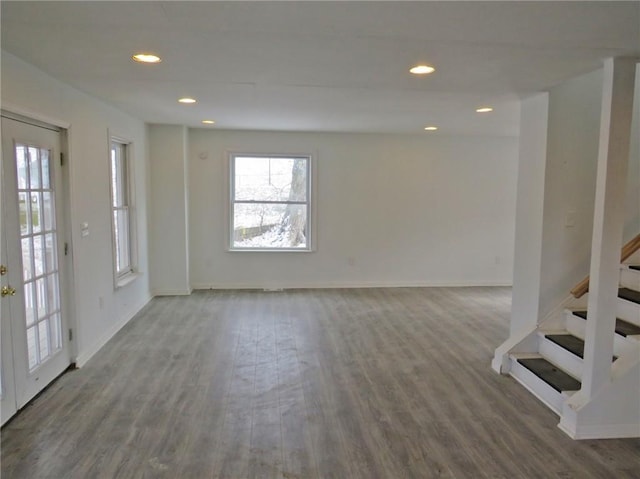 interior space with stairs, wood finished floors, and recessed lighting