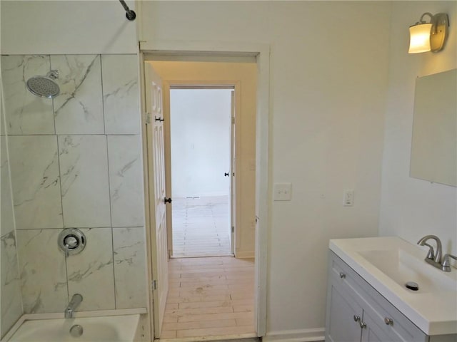 bathroom featuring shower / bath combination and vanity