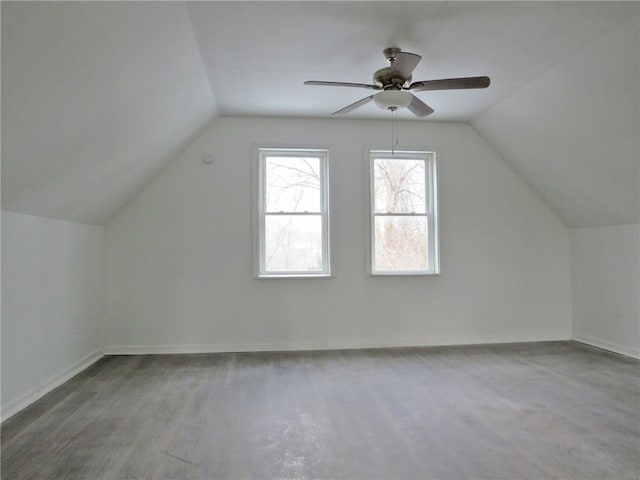 bonus room featuring lofted ceiling, ceiling fan, baseboards, and wood finished floors