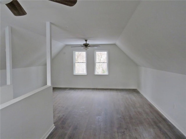 bonus room featuring vaulted ceiling, wood finished floors, and baseboards