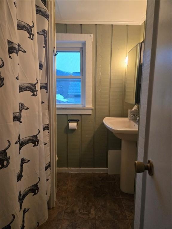 bathroom featuring tile patterned flooring and ornamental molding