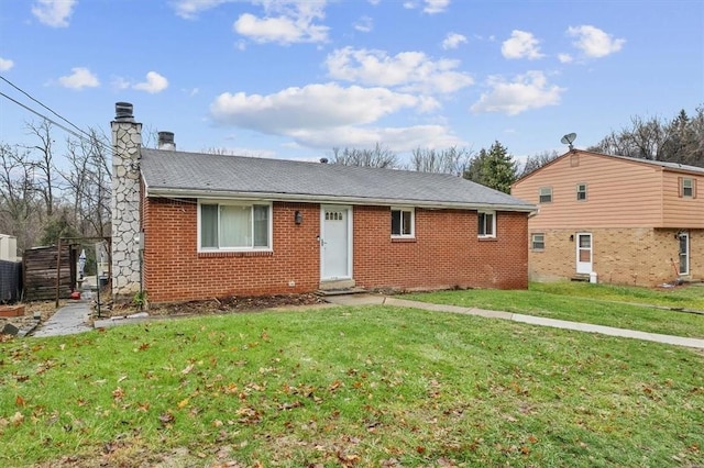 ranch-style home with a front lawn