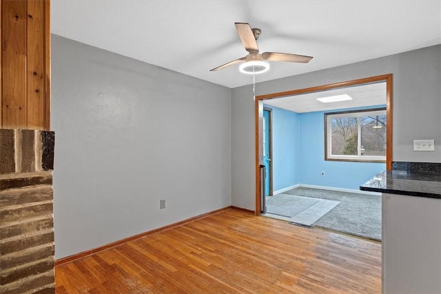 interior space featuring ceiling fan and light wood-type flooring