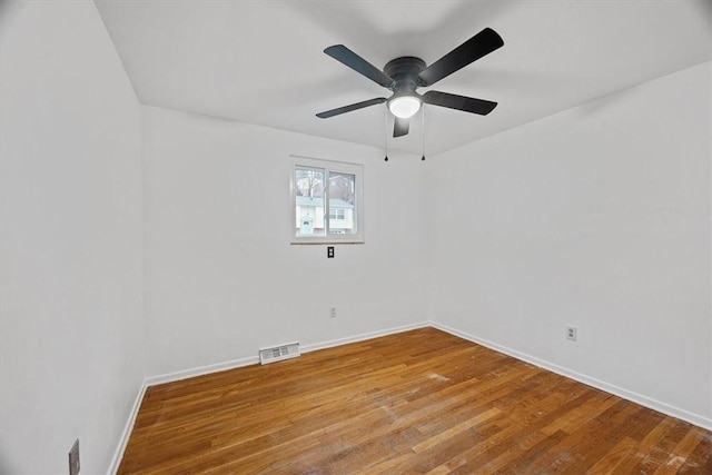 spare room with ceiling fan and wood-type flooring