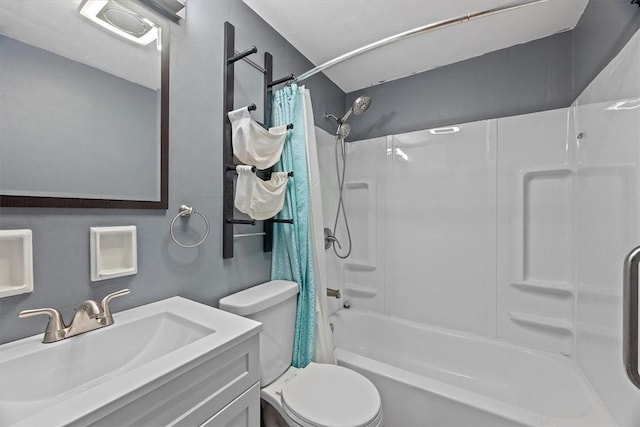 full bathroom featuring shower / bath combination with curtain, vanity, and toilet