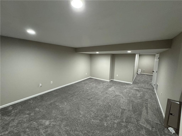 basement with dark carpet