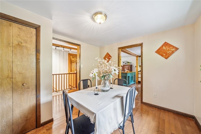 dining room featuring light hardwood / wood-style flooring