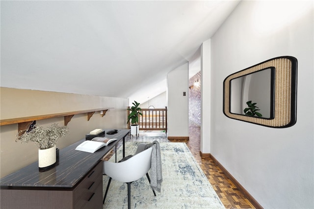 home office with lofted ceiling and parquet flooring