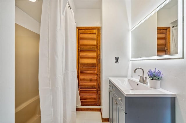 bathroom with a shower with curtain, tile patterned flooring, and vanity