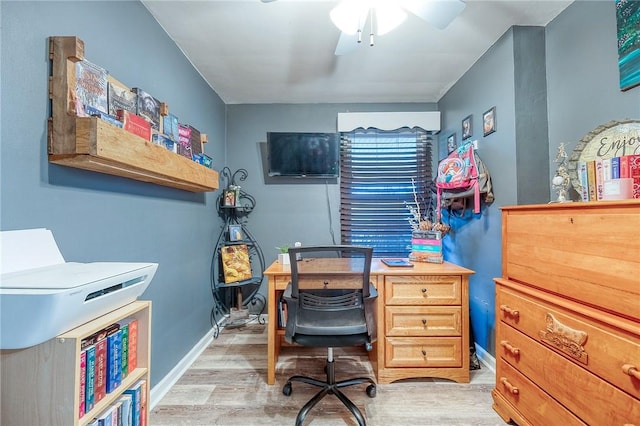 home office featuring ceiling fan and light hardwood / wood-style floors