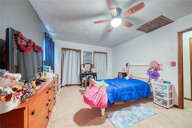 bedroom with light colored carpet and ceiling fan