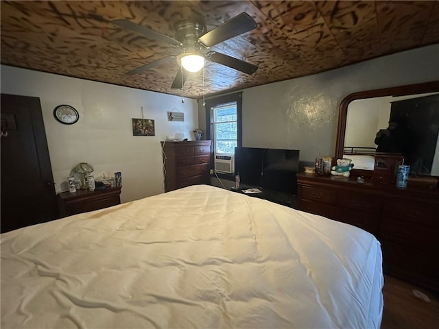 bedroom with ceiling fan and cooling unit