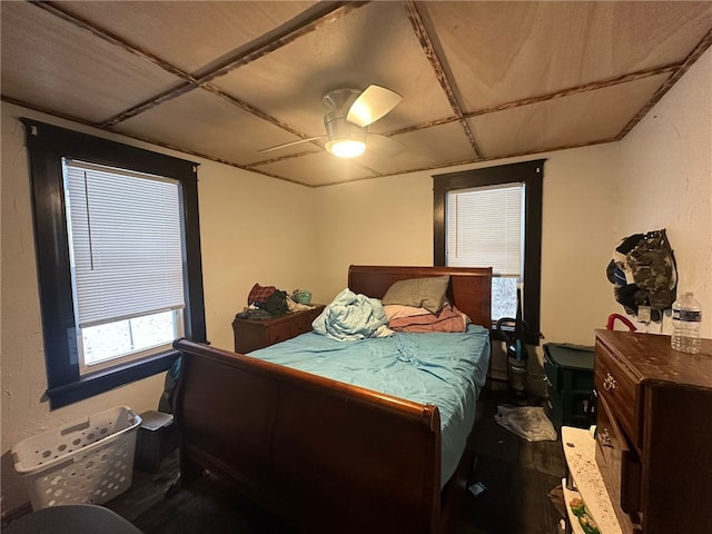 bedroom featuring ceiling fan and wood-type flooring