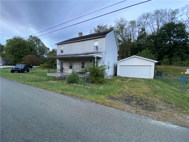 view of front of property with a porch, a garage, an outdoor structure, and a front yard