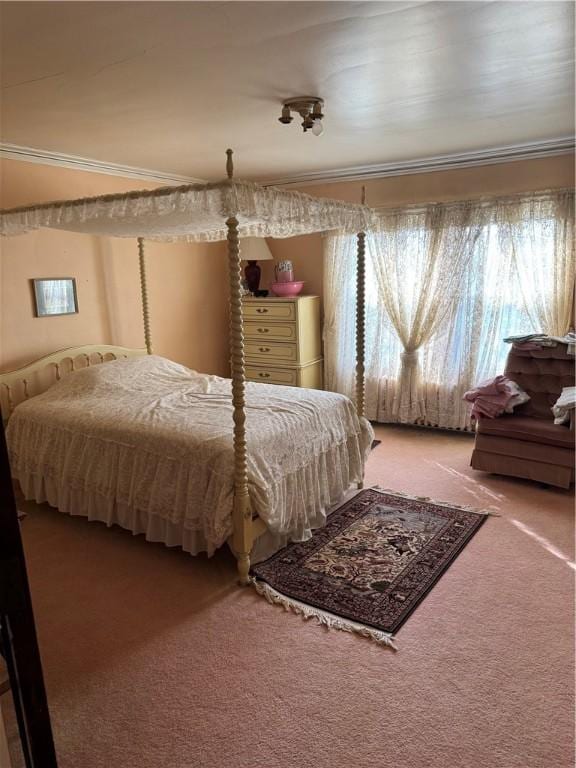 bedroom featuring carpet flooring and ornamental molding