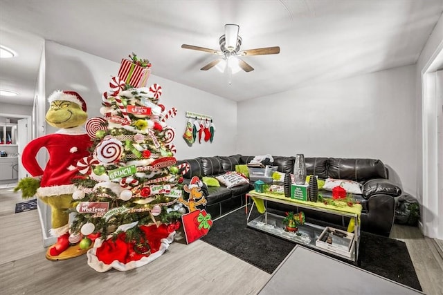 playroom with ceiling fan and wood-type flooring