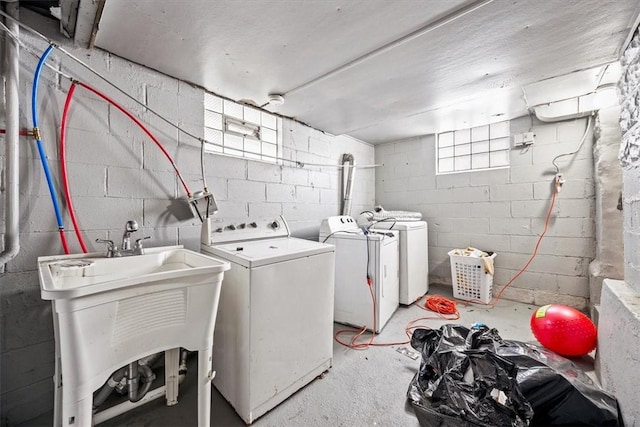 laundry room with sink and washing machine and clothes dryer