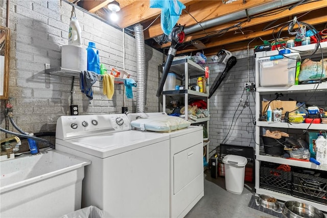 laundry room featuring separate washer and dryer and sink