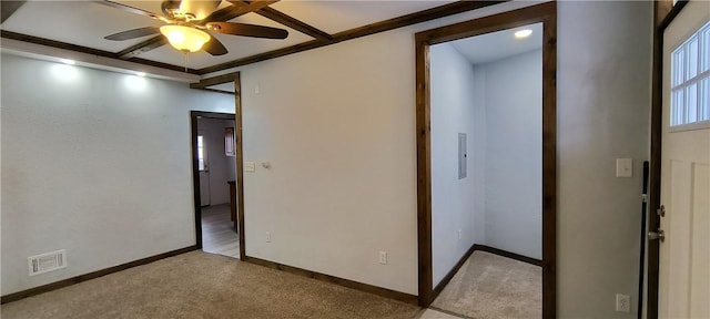 carpeted empty room featuring ceiling fan and crown molding