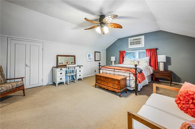 carpeted bedroom with an AC wall unit, ceiling fan, and lofted ceiling