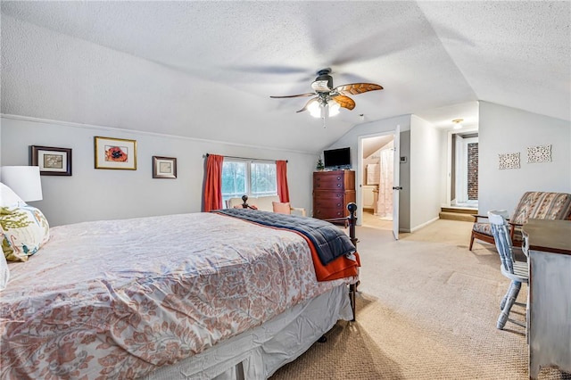 carpeted bedroom featuring ceiling fan, lofted ceiling, a textured ceiling, and connected bathroom