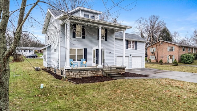 view of front of property with a garage and a front lawn