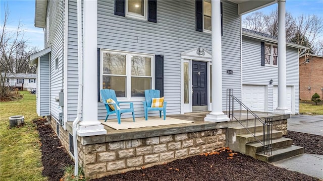 exterior space featuring a porch and a garage