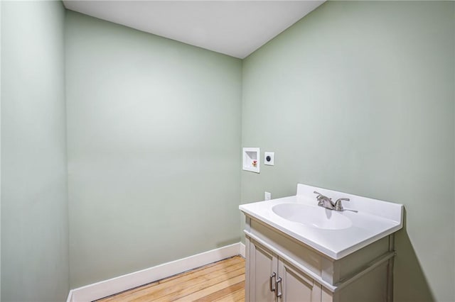 bathroom with wood-type flooring and vanity