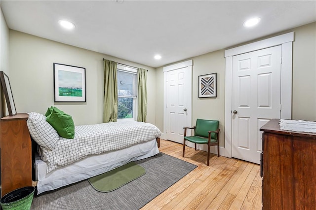 bedroom with light wood-type flooring