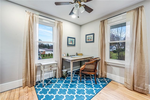 office space with hardwood / wood-style flooring and ceiling fan