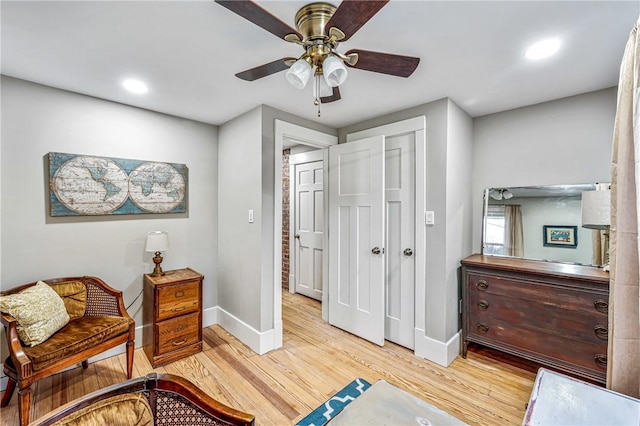 sitting room featuring ceiling fan and light hardwood / wood-style flooring