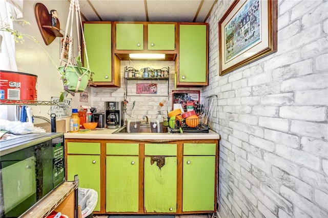 kitchen with sink and brick wall