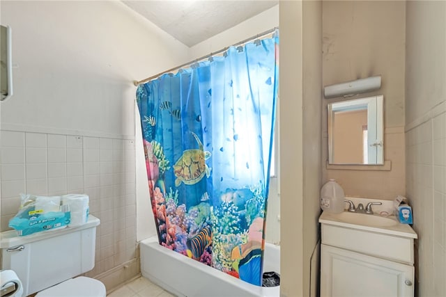 full bathroom with toilet, tile walls, and shower / tub combo