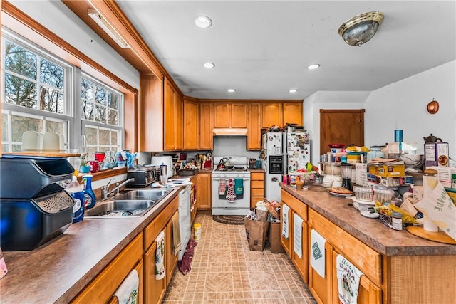 kitchen with sink and white appliances