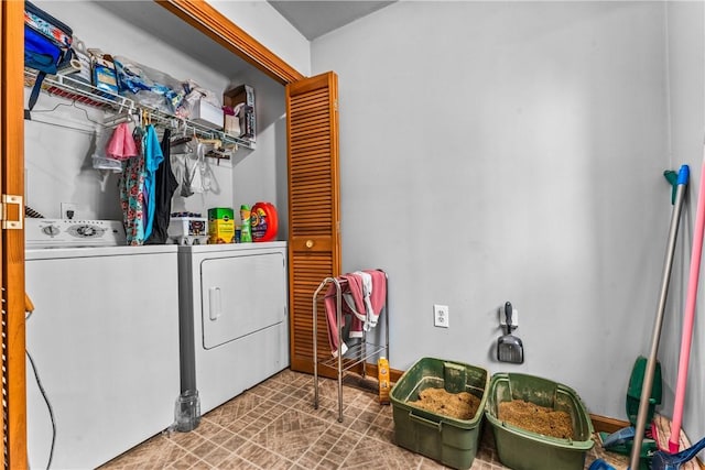 laundry room with washing machine and clothes dryer