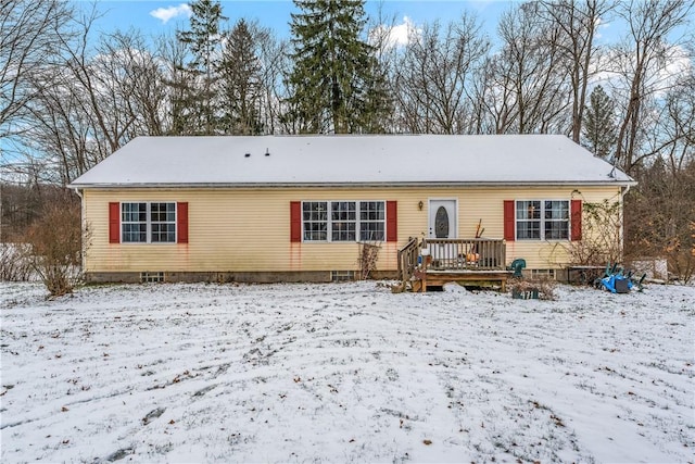 view of front of home featuring a wooden deck