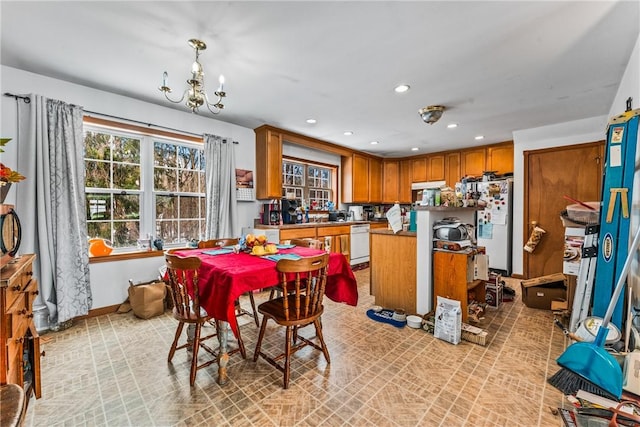 dining space featuring an inviting chandelier