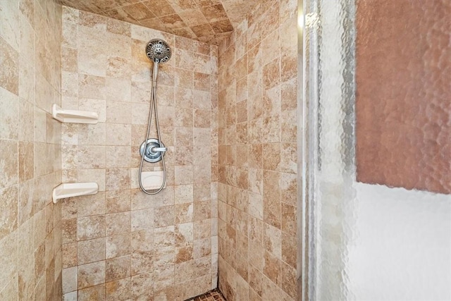 bathroom with tiled shower