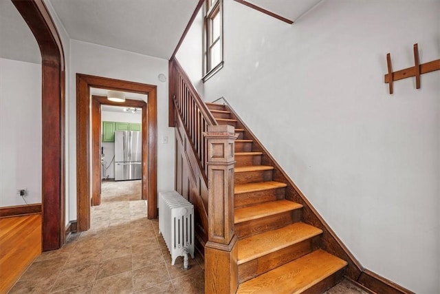 staircase featuring radiator