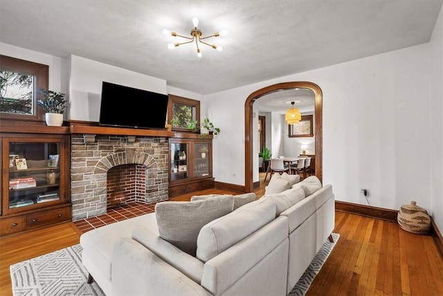 living room featuring hardwood / wood-style flooring and a notable chandelier