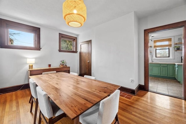 dining space with light wood-type flooring