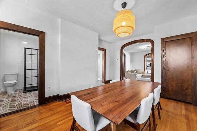 dining space with light hardwood / wood-style floors